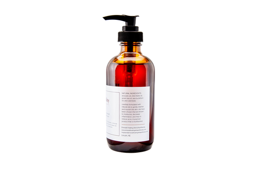 Eight ounce Facial Cleansing Oil and Serum bottle with label visible