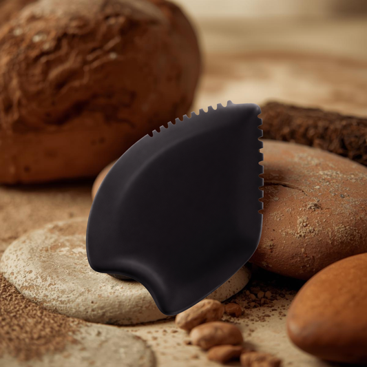 Bian stone gua sha tool showing the polished multi-edge shape