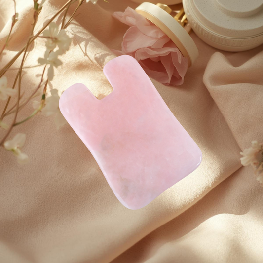 Rose quartz gua sha tool shown for gentle facial massage