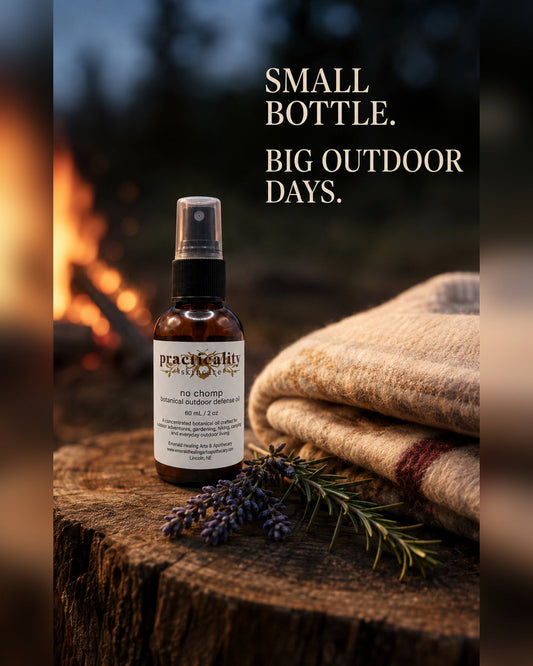 No Chomp Botanical Outdoor Defense Oil 2 oz beside a campfire and folded blanket